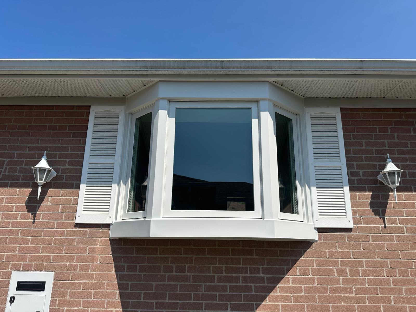 White bay window installed on a brick home in North York