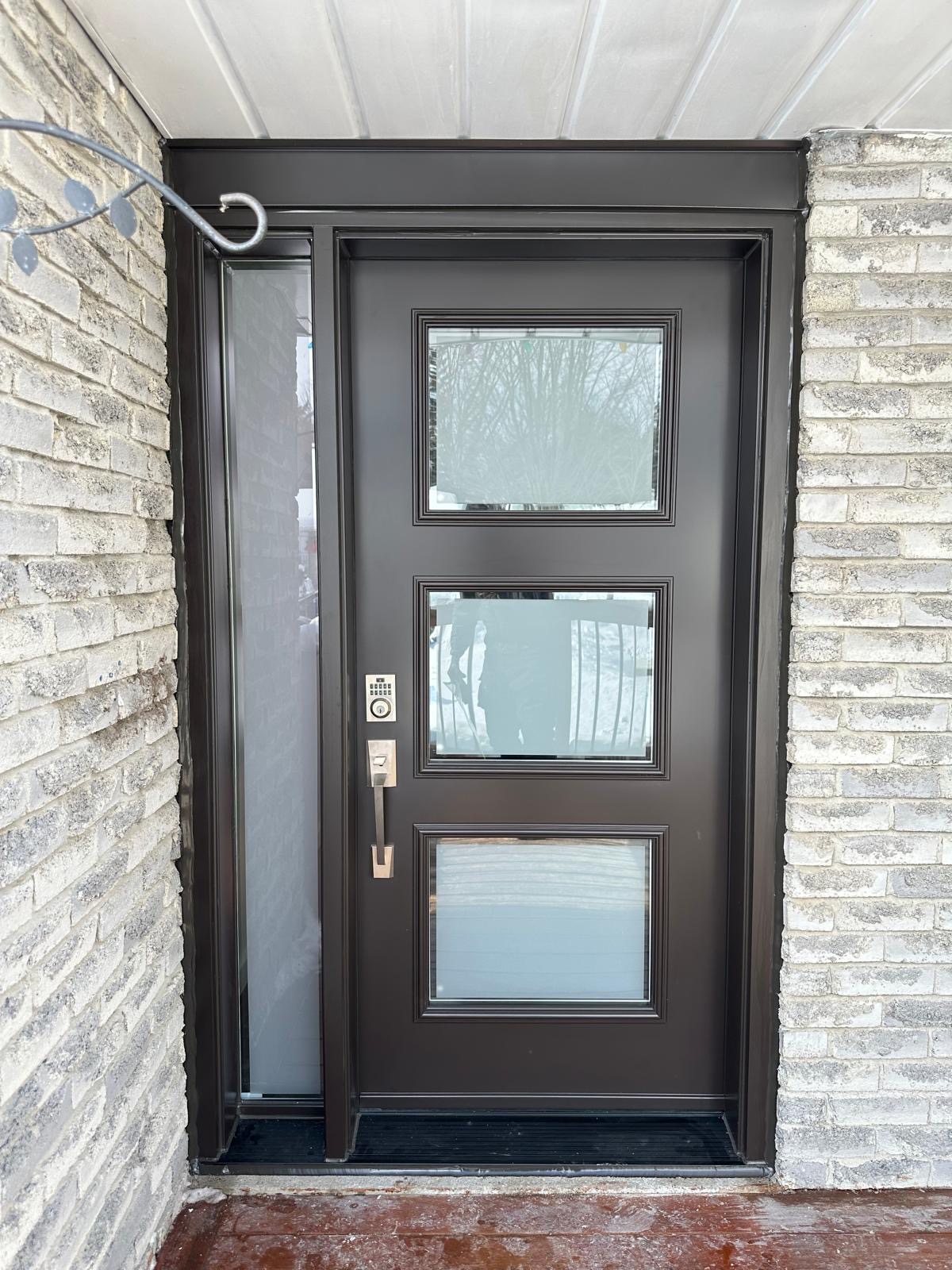 Dark entry door with sidelite and three glass panels
