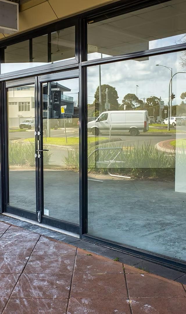 Commercial storefront glazing with aluminum doors